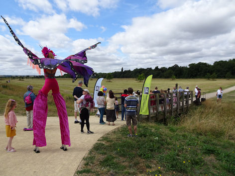 Trumpington Meadows event at the local centre, to celebrate the 5th anniversary of Trumpington Meadows Country Park: unveiling new carvings on the footbridge into the park. Photo: Andrew Roberts, 14 August 2021.
